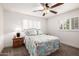 Inviting bedroom featuring a ceiling fan and sunlit windows at 7802 N 6Th St, Phoenix, AZ 85020