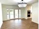 Open dining room with tile flooring and glass doors overlooking the backyard at 7802 N 6Th St, Phoenix, AZ 85020