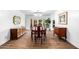 Formal dining room with elegant chandelier, classic wood furniture, and sliding doors to the outdoor living area at 7802 N 6Th St, Phoenix, AZ 85020