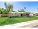 Inviting single-Gathering home with lush green lawn and a charming, covered entryway at 7802 N 6Th St, Phoenix, AZ 85020