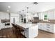 Bright, updated kitchen boasts a large island, stainless steel appliances, and white cabinetry at 7802 N 6Th St, Phoenix, AZ 85020