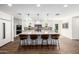Modern kitchen featuring a large island with seating and pendant lighting at 7802 N 6Th St, Phoenix, AZ 85020