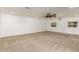 Open living space with neutral carpet and clean white walls, perfect for versatile decor at 7802 N 6Th St, Phoenix, AZ 85020