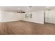 Bright, open living area with tile floors and white walls, offering a view of the entryway and natural light at 7802 N 6Th St, Phoenix, AZ 85020