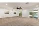 Expansive bedroom with neutral carpet, slider access to pool area, and bright, airy ambiance at 7802 N 6Th St, Phoenix, AZ 85020