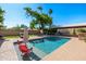 Sparkling pool featuring a Baja shelf and shaded lounge areas, ideal for relaxation and outdoor enjoyment at 7802 N 6Th St, Phoenix, AZ 85020