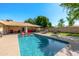 Inviting backyard pool surrounded by ample patio space, comfortable seating, and mature landscaping at 7802 N 6Th St, Phoenix, AZ 85020