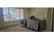Bright bedroom showing flooring materials stacked on pallets, waiting for install at 7962 W Lincoln St, Peoria, AZ 85345