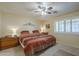 Serene bedroom with ceiling fan, ample natural light, and carpet flooring at 8160 E Keats Ave # 364, Mesa, AZ 85209