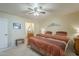 Bright bedroom with ensuite bathroom, ceiling fan, and neutral color palette at 8160 E Keats Ave # 364, Mesa, AZ 85209