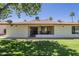 Charming home with a covered patio for outdoor enjoyment and lush green lawn at 8160 E Keats Ave # 364, Mesa, AZ 85209