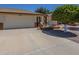 Charming single-story home featuring an attached two-car garage, brick accents, and a welcoming front patio at 8160 E Keats Ave # 364, Mesa, AZ 85209