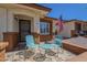 Inviting front porch with a charming seating area, brick accents, and an American flag, perfect for relaxation at 8160 E Keats Ave # 364, Mesa, AZ 85209