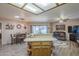 Open floor plan with peninsula counter connecting kitchen to dining and living area at 8160 E Keats Ave # 364, Mesa, AZ 85209