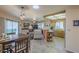 Open living area with a combined kitchen and dining space, featuring modern appliances and comfortable seating at 8160 E Keats Ave # 364, Mesa, AZ 85209