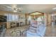 Inviting living room with wood floors, ceiling fan, and open view into the kitchen at 8160 E Keats Ave # 364, Mesa, AZ 85209