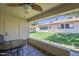 Relax on the covered patio with tile floor overlooking the manicured community lawn at 8160 E Keats Ave # 364, Mesa, AZ 85209