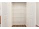 Walk-in closet with shelving, providing ample storage space at 8321 W Hughes Dr, Tolleson, AZ 85353