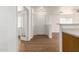 Inviting entryway featuring wood floors and a bright, open floor plan, enhancing the home's curb appeal at 8321 W Hughes Dr, Tolleson, AZ 85353