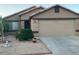 Single level home featuring low maintenance desert landscaping and attached two car garage at 8338 W Coolidge St, Phoenix, AZ 85037