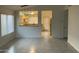 Bright, airy living room with tile floors and an open floor plan to the kitchen at 8338 W Coolidge St, Phoenix, AZ 85037