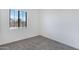 Neutral bedroom with carpet, one window with blinds, and electrical outlets at 8350 W Carole Ln, Glendale, AZ 85305