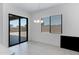 Dining area featuring a sliding glass door to the backyard and modern chandelier at 8350 W Carole Ln, Glendale, AZ 85305