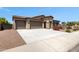 Wide driveway leading to the two-car garage of this beautiful home, enhancing curb appeal at 8350 W Carole Ln, Glendale, AZ 85305