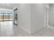 Clean hallway with tile flooring and access to backyard with sliding glass doors at 8350 W Carole Ln, Glendale, AZ 85305