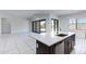 Spacious open floor plan features a kitchen with a large island and sleek, modern finishes at 8350 W Carole Ln, Glendale, AZ 85305