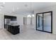 Kitchen island featuring quartz counters, stainless appliances, and contemporary chandelier at 8350 W Carole Ln, Glendale, AZ 85305