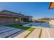 Backyard with a swimming pool, outdoor living space, modern landscaping and an outdoor living space at 8366 E Old Paint Trl # 3, Scottsdale, AZ 85266