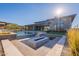 Outdoor entertaining area featuring a swimming pool, fire pit, and modern house at 8366 E Old Paint Trl # 3, Scottsdale, AZ 85266