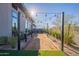 Entertainers backyard with a bocce ball court and hanging lights at 8366 E Old Paint Trl # 3, Scottsdale, AZ 85266