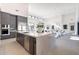 Open concept kitchen with center island, stainless steel appliances, and access to the living room at 8366 E Old Paint Trl # 3, Scottsdale, AZ 85266
