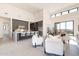 Open concept living room and kitchen space with modern design, barstool seating, and a cozy feel at 8366 E Old Paint Trl # 3, Scottsdale, AZ 85266