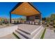 Outdoor kitchen featuring built-in grill, stainless steel appliances, prep areas, and bar seating for entertaining guests at 8366 E Old Paint Trl # 3, Scottsdale, AZ 85266