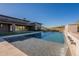 Backyard featuring a swimming pool, outdoor kitchen with a waterfall feature, landscaping and an outdoor living space at 8366 E Old Paint Trl # 3, Scottsdale, AZ 85266