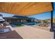 Backyard oasis featuring a covered patio, swimming pool with spa, outdoor kitchen, and lush landscaping at 8366 E Old Paint Trl # 3, Scottsdale, AZ 85266