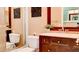 Bathroom featuring a vanity, mirror, and toilet with tiled shower, showcasing functional design at 9248 E Blanche Dr, Scottsdale, AZ 85260