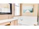 Bright bathroom features a large soaking tub and a shower with glass doors at 9248 E Blanche Dr, Scottsdale, AZ 85260