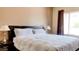 Neutral Primary bedroom features a king-sized bed, side tables and window at 9248 E Blanche Dr, Scottsdale, AZ 85260