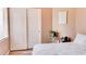 Bright bedroom featuring a comfortable bed, sliding closet doors, and neutral decor at 9248 E Blanche Dr, Scottsdale, AZ 85260