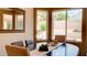 Sunlit dining room with a modern table, stylish chairs, and views of the well-maintained yard at 9248 E Blanche Dr, Scottsdale, AZ 85260