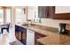 Bright kitchen with granite countertops, stainless steel appliances, and a modern faucet at 9248 E Blanche Dr, Scottsdale, AZ 85260