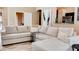 Stylish living room with an open floor plan, neutral sectional, and luxury vinyl flooring at 9248 E Blanche Dr, Scottsdale, AZ 85260