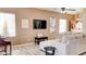 Bright living room with modern decor, a large sectional, and luxury vinyl flooring at 9248 E Blanche Dr, Scottsdale, AZ 85260
