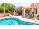 Inviting pool area with lounge chairs and a shaded patio, perfect for outdoor entertaining at 9248 E Blanche Dr, Scottsdale, AZ 85260