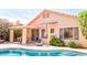 Outdoor pool area featuring a covered patio and lush landscaping, ideal for relaxation at 9248 E Blanche Dr, Scottsdale, AZ 85260