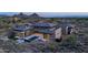 Expansive estate with a pool, spa, and scenic desert mountain views at 9750 E Troon North Dr, Scottsdale, AZ 85262
